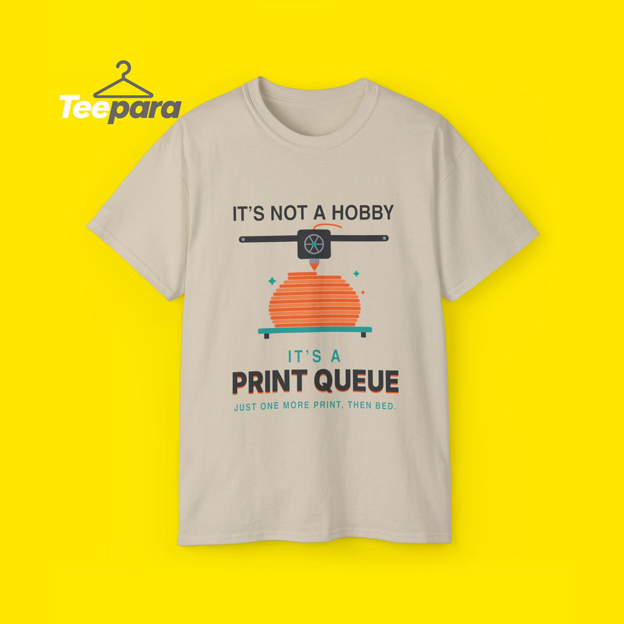 Funny 3D printing t-shirt, It's Not a Hobby It's a Print Queue, front view on TeePara yellow background