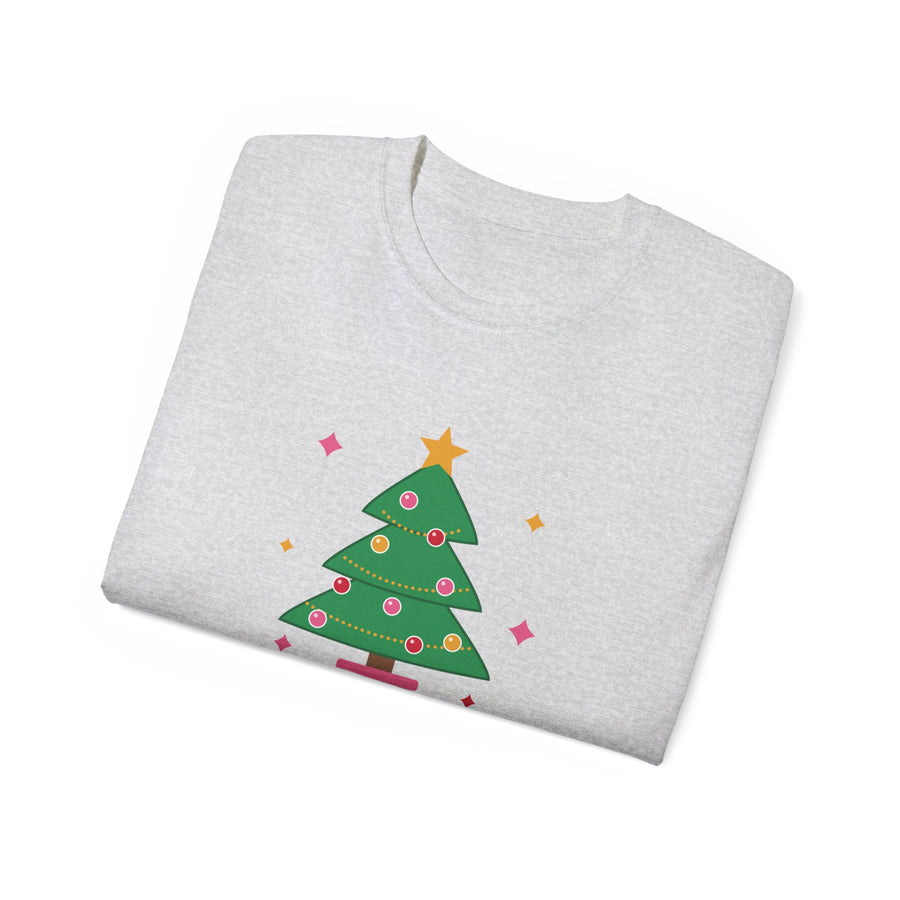 Merry and Extra whimsical Christmas graphic t-shirt by TeePara, folded and worn by a model