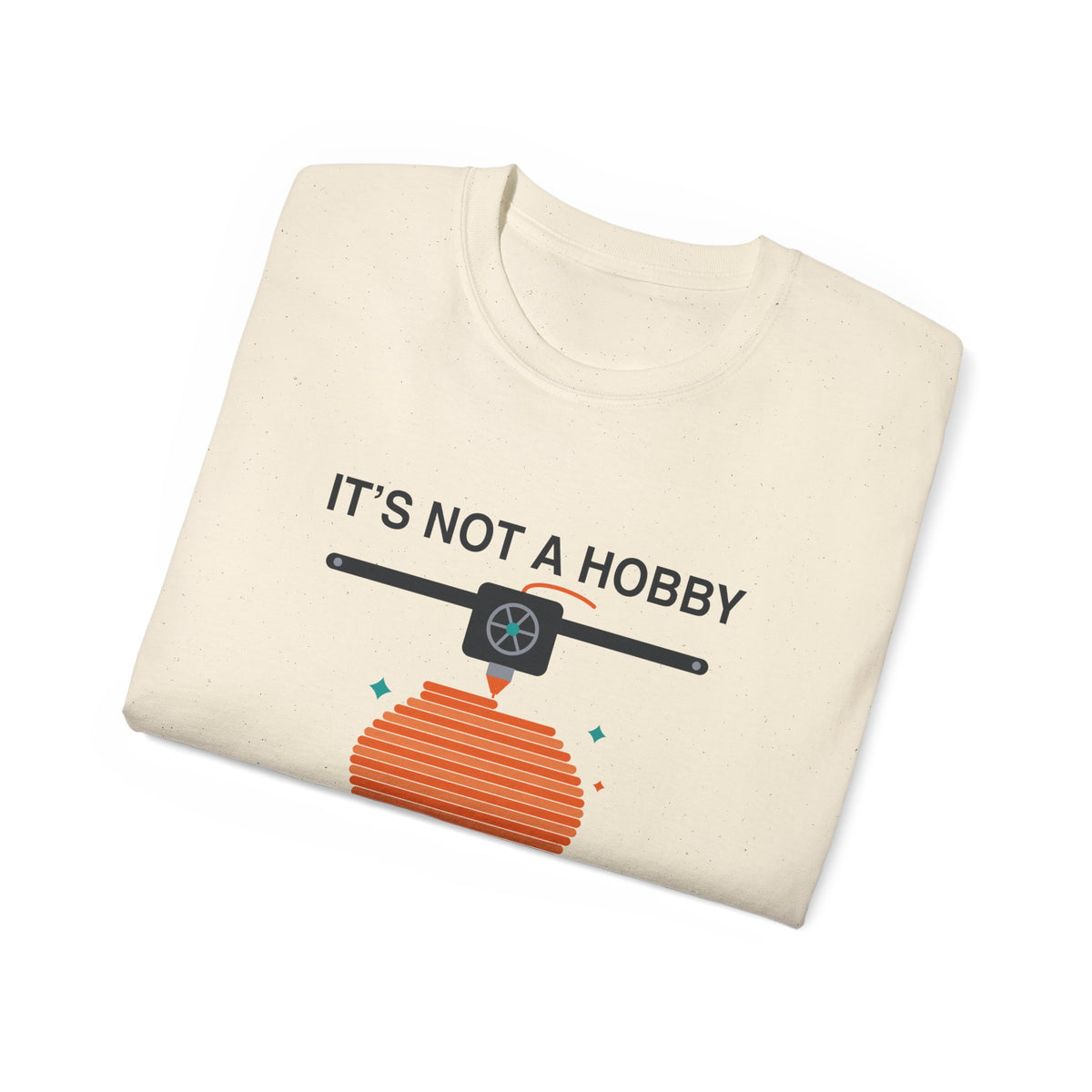 It's a Print Queue 3D printing graphic t-shirt by TeePara, folded and worn by a model