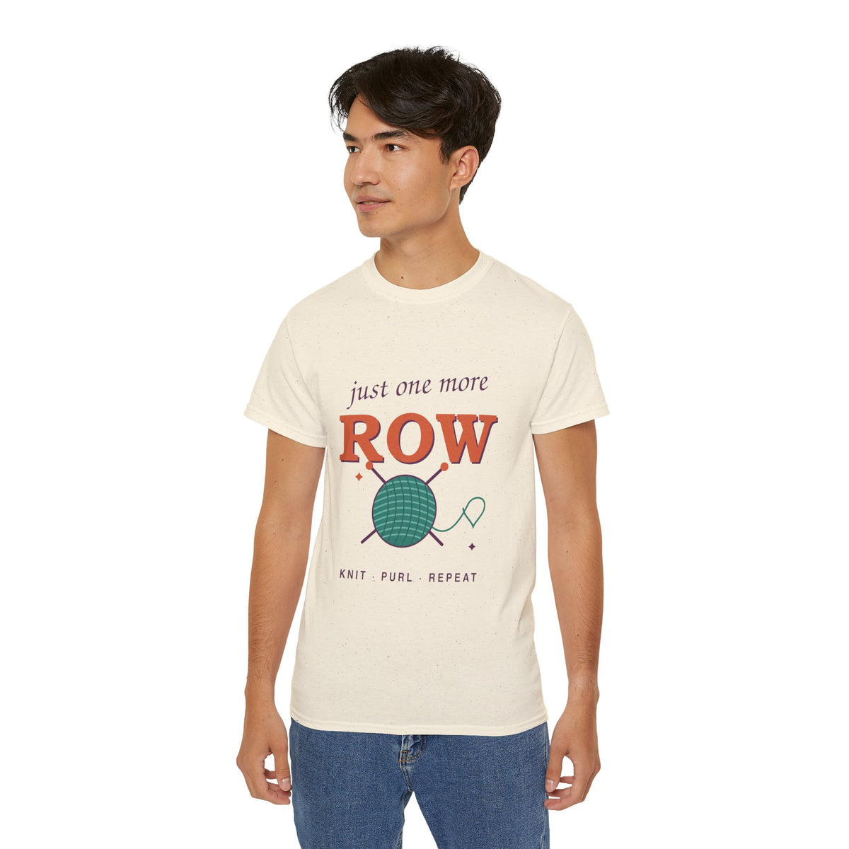 Just One More Row knitting and crochet graphic t-shirt by TeePara, folded and worn by a model
