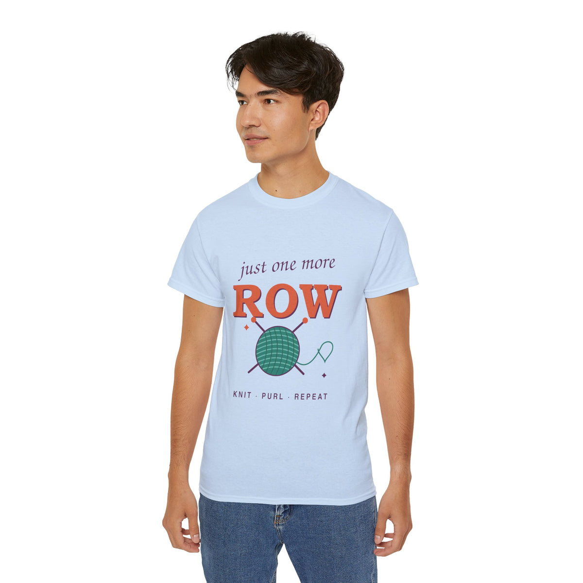 Just One More Row knitting and crochet graphic t-shirt by TeePara, folded and worn by a model