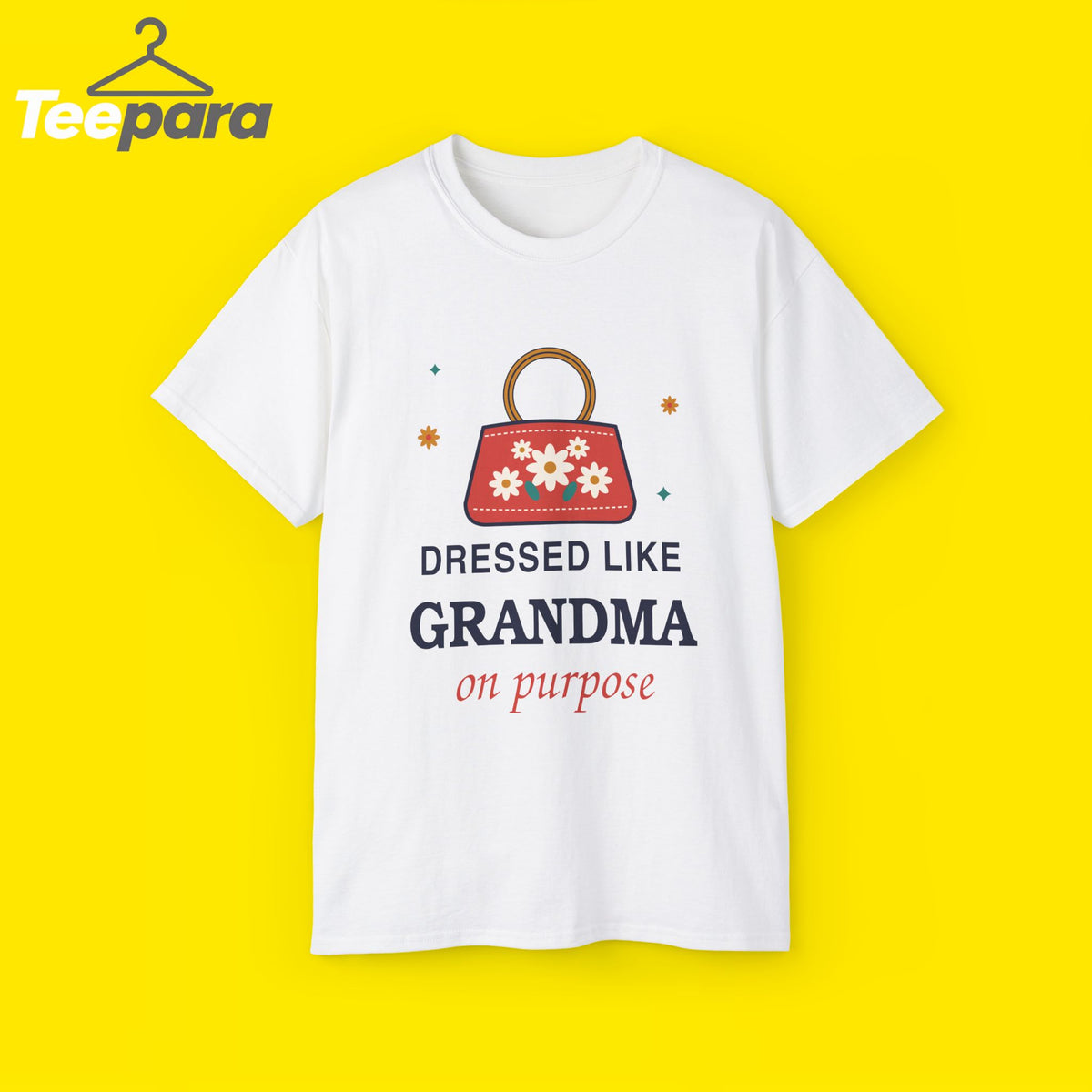 White unisex t-shirt with a floral embroidered handbag with a wooden ring handle and the text Dressed Like Grandma On Purpose